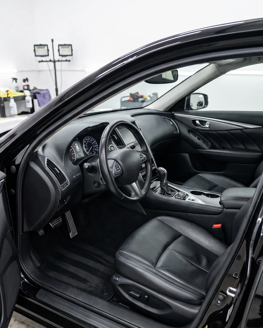 A freshly detailed black leather interior